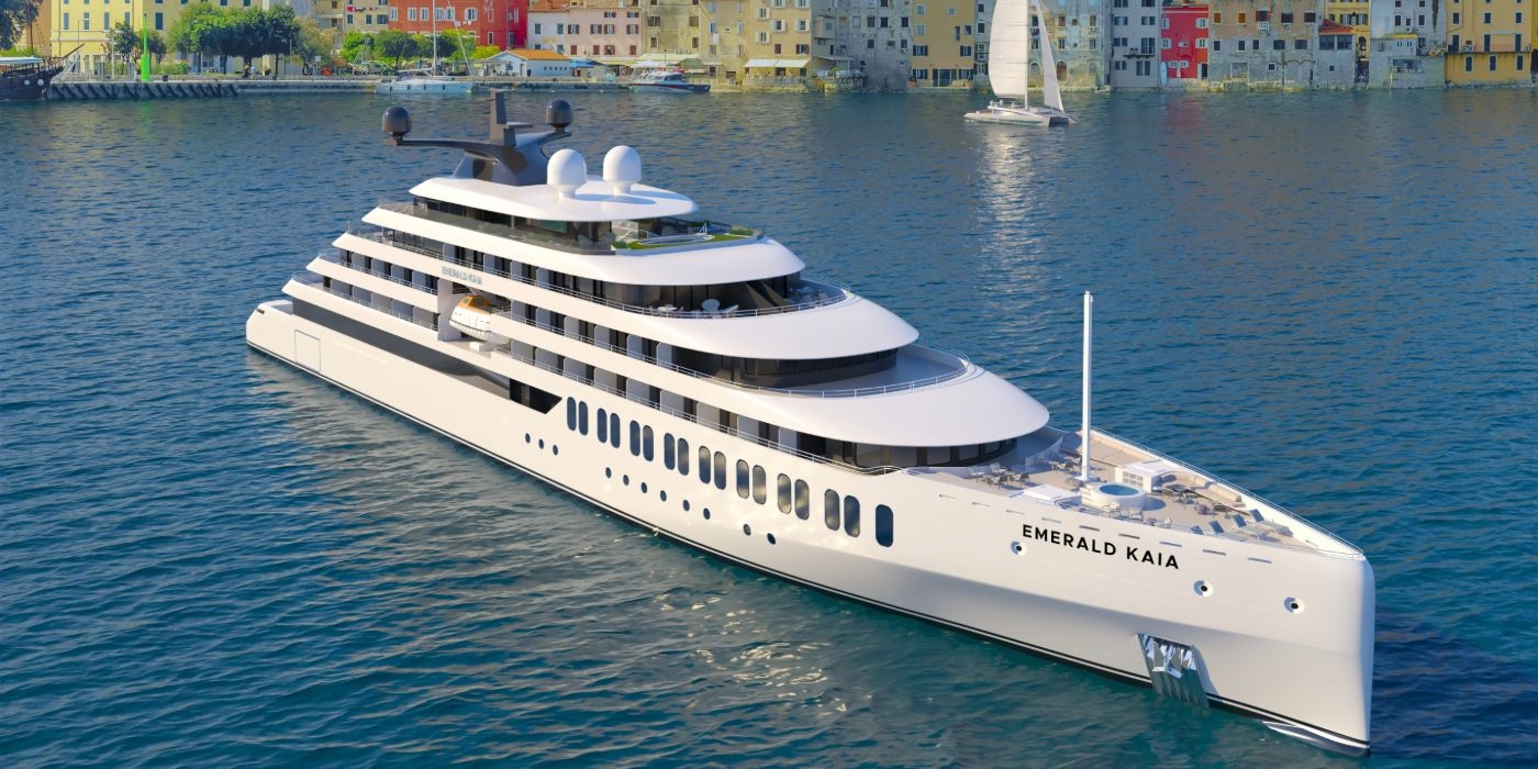 Emerald Kaia floats gracefully on the calm water, reflecting the serene surroundings.