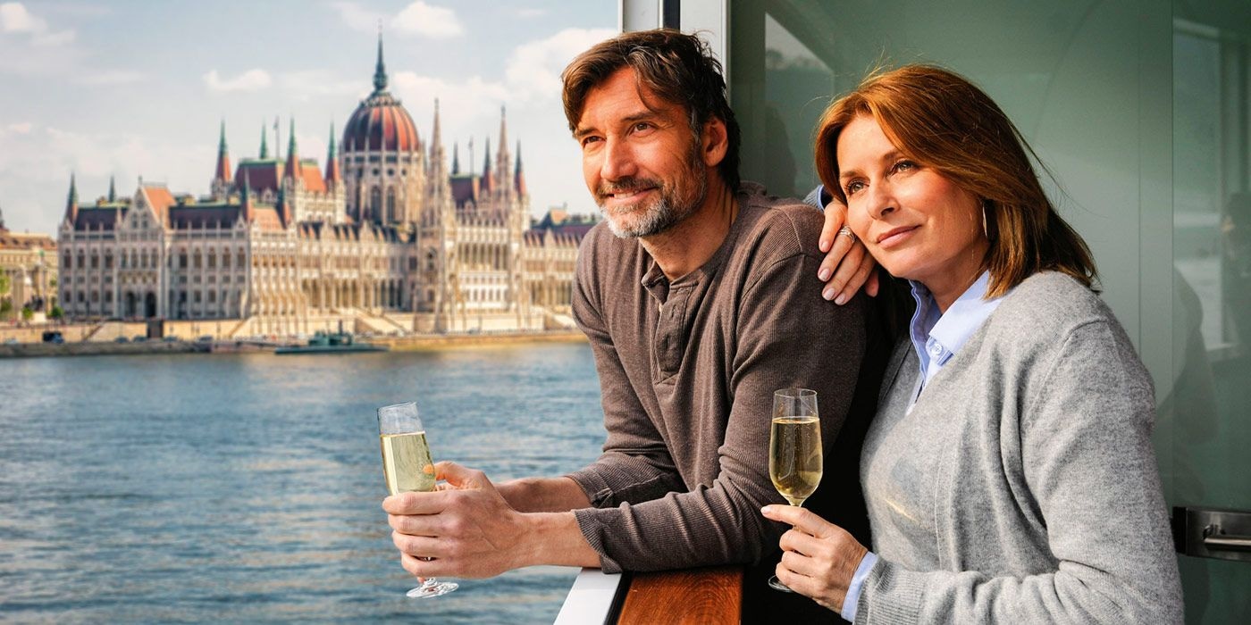 Couple overlooking water by their balcony