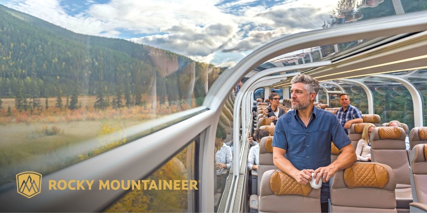 Man enjoying the view on a Rocky Mountaineer rail journey
