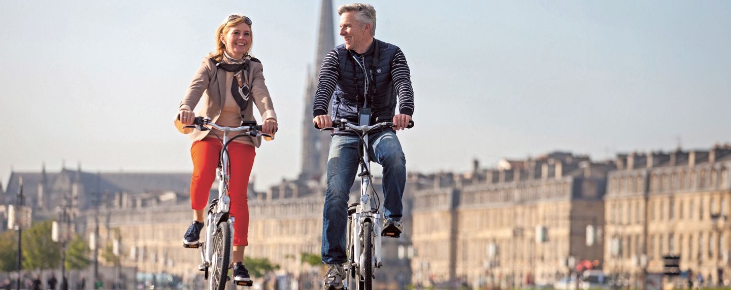 Couple on e-bikes in France